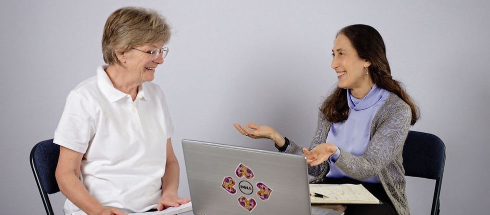 a woman talking to another woman and gesturing with hands