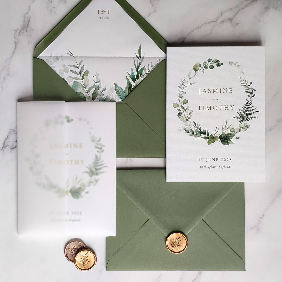 Woodland foliage wedding invitation with vellum wrap and sage green envelope