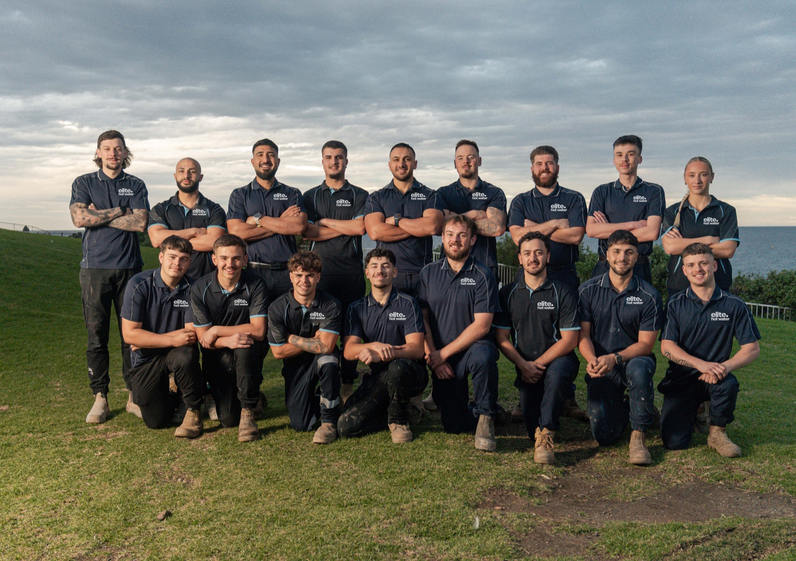 The Elite Hot Water team together outdoors