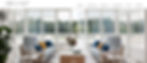 A screenshot of StephensonWright.com showing a large bright symmetrical white garden room