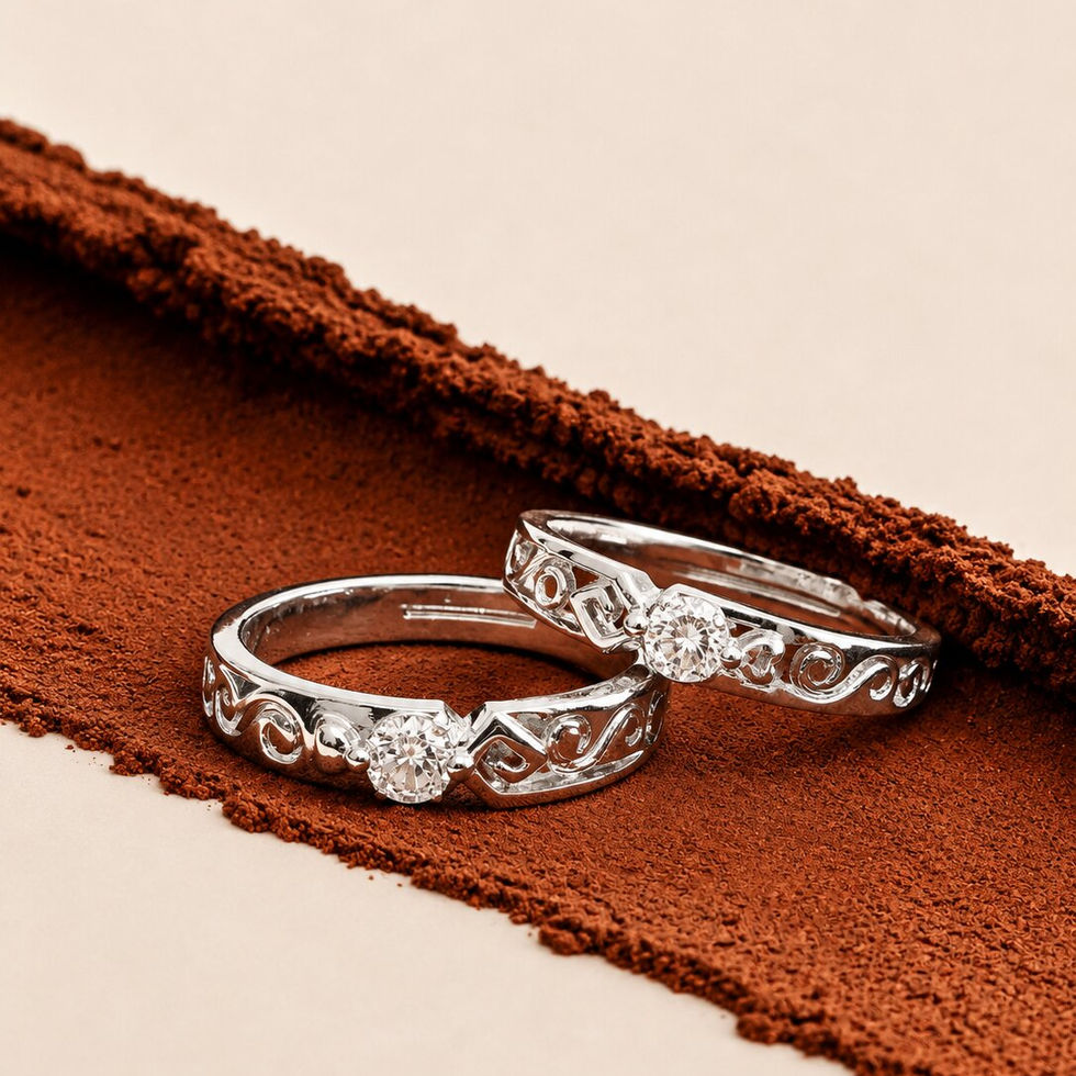 Elegant silver couple rings with vine-inspired detailing and sparkling solitaire stones.