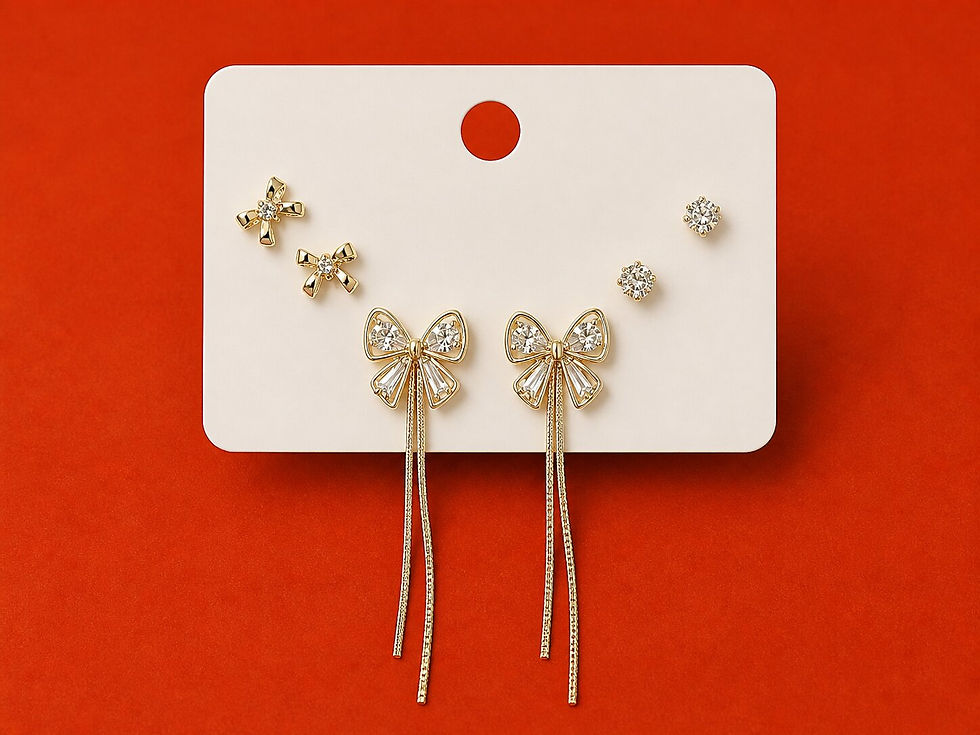 Belléza Bow Spark anti-tarnish set of three earrings featuring bow studs, crystal studs, and bow tassel earrings