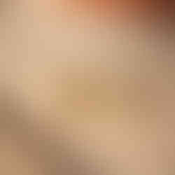 close up studio image of Avantikam Dual Heart stainless steel anti tarnish designer earrings for women India on luxury beige