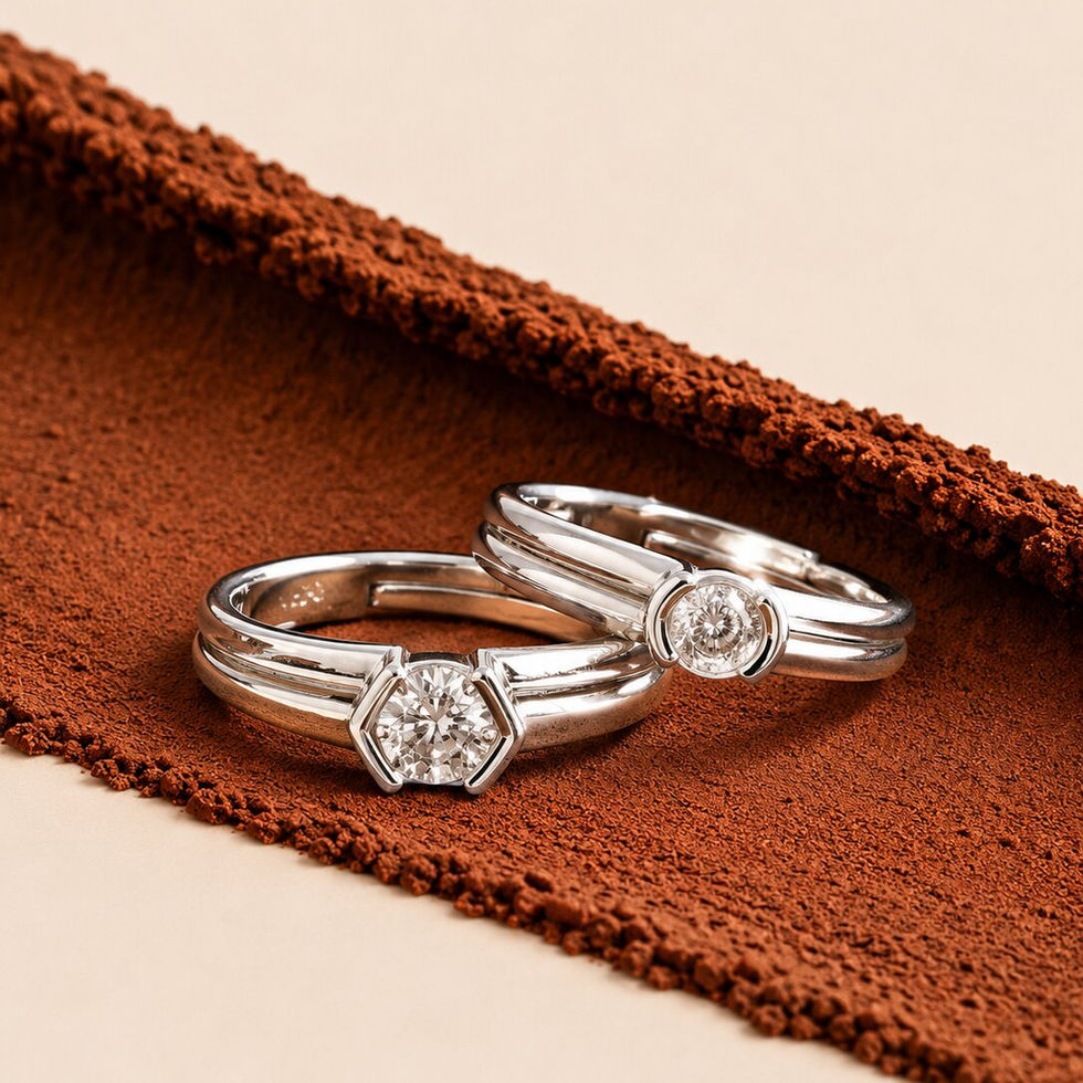 Elegant silver couple rings with solitaire stones and modern double-band detailing.