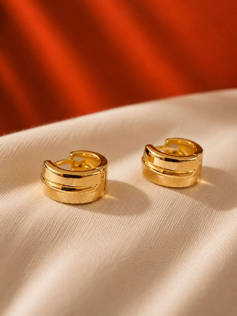 Minimalist Gold Layered Hoop Earrings with glossy gold finish and modern chunky layered design.