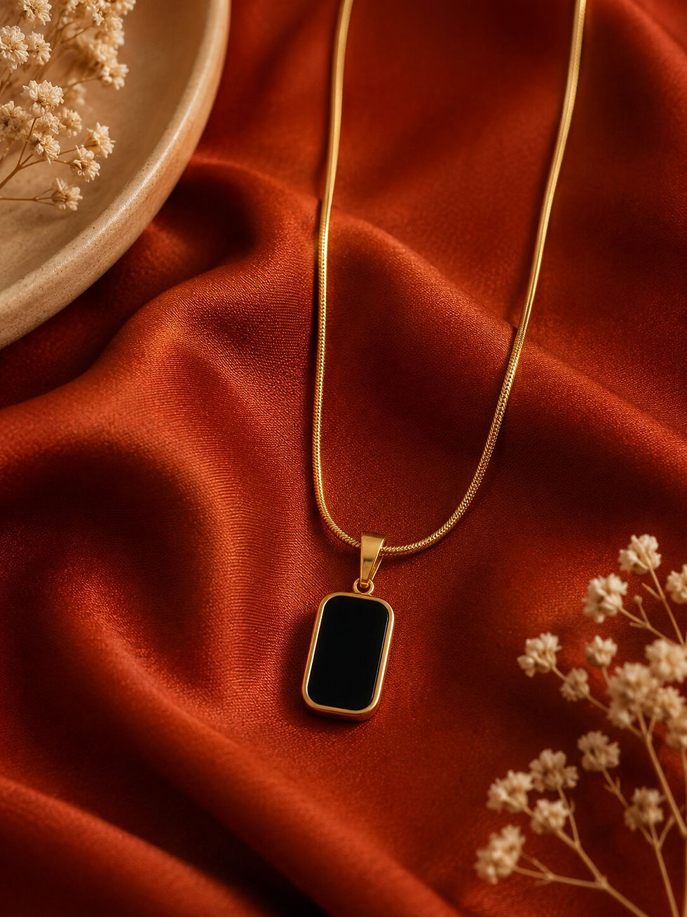 Anti-tarnish gold necklace featuring a reversible rectangular pendant with black on one side and white on the other, styled o