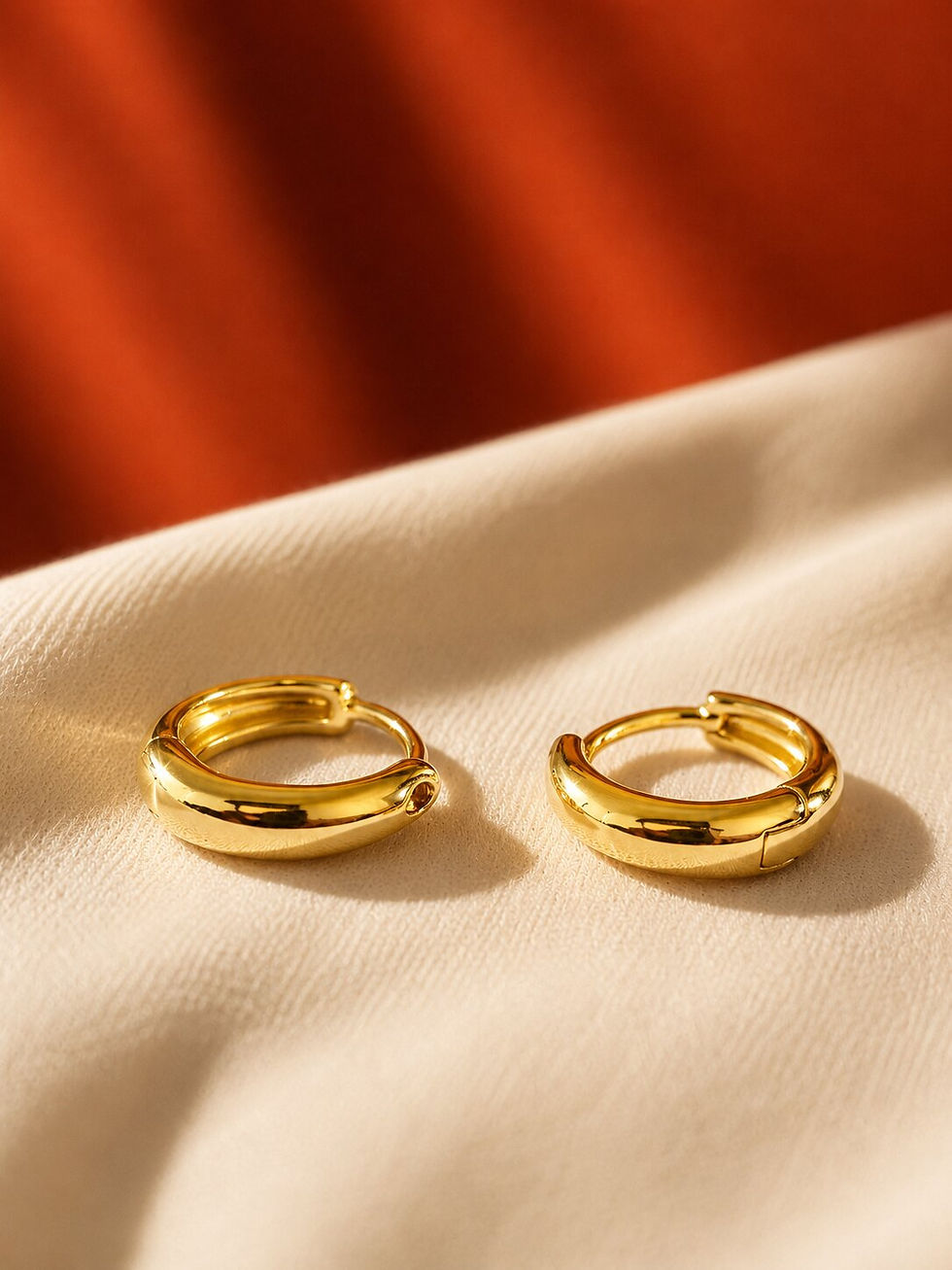 Elegant Minimal Gold Hoop Earrings with sleek polished gold finish and modern chunky design.