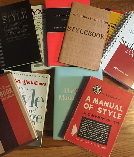 Photo of 10 old style books of various types.