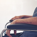 side-view-senior-woman-sitting-wheelchair-by-window.jpg