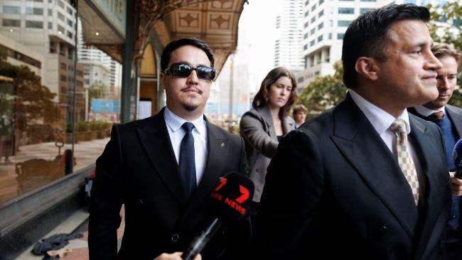 Ahmad Rashad Nadir (left) leaves the Downing Centre court with his lawyer