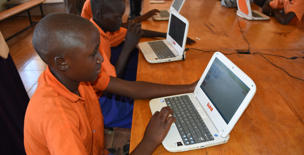 Students in computer lab, no access to internet, but can learn ICT skills through downloaded curriculum.