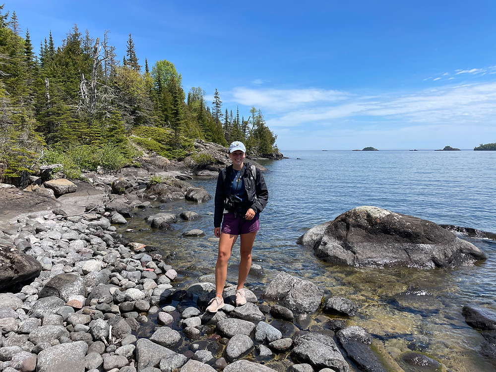 Article writer Abby on the rocky shores of Isle Royale National Park