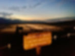 Eerie light fades over Badwater Basin, as a sign indicates that this is indeed the lowest place in North America - 282 feet below sea level