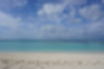 A pristine, empty beach with the pale green-blue waters of the Caribbean at Dry Tortugas National Park