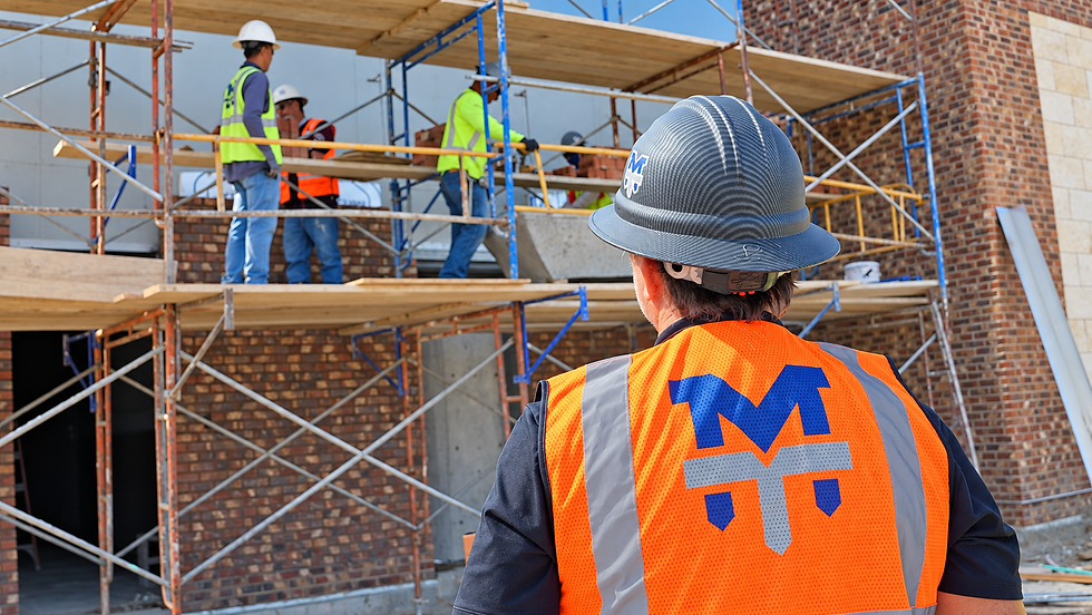 MidTex Masonry crew working on scaffolding at a brick jobsite