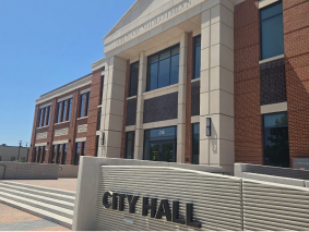 Government building entrance with cast stone signage, masonry by MidTex Masonry