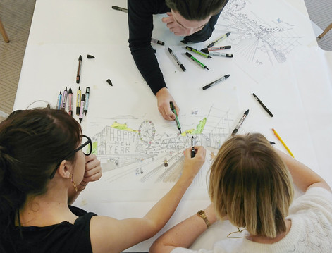 An image of women drawing and collaborating on a design from STUDIOS' career page