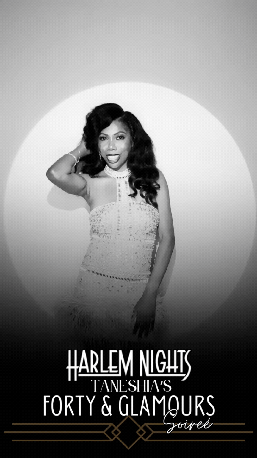 Black and white spotlight booth portrait at 40th birthday party with elegant private event styling.