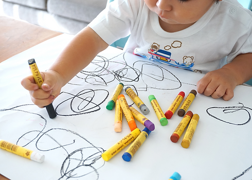Child scribbling on paper