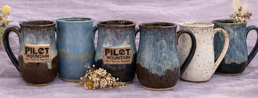 banner photo of various mugs.png