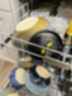 Cris the Potters full dishwasher at home.