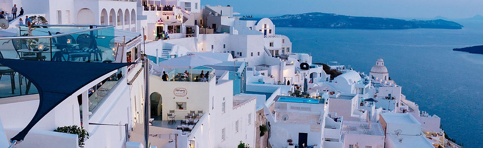 vertical-high-angle-shot-white-buildings-santorini-greece.jpg