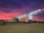 Industrial fleet equipment at sunset.