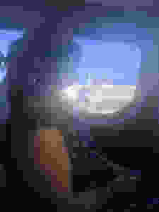 Siri Kay Jostad of Wander Away with Siri Kay riding in the back of a car on Santorini Greece