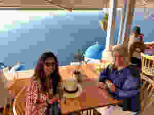 Vaishali Patel of Sanskar Teaching and Siri Kay Jostad of Wander Away with Siri Kay dining at Terpsi N Oia in Santorini Greece