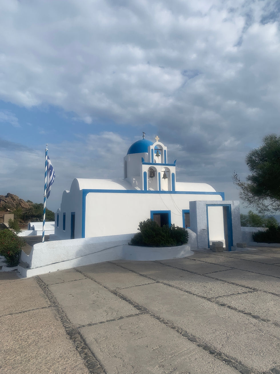 Blue domed Greek church on the path between Oia and Fira in Santorini Greece