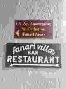 direction signs to Fenari Villas and Restaurant in Oia Santorini Greece