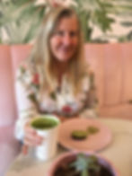 Siri Kay Jostad of Wander Away with Siri Kay drinking matcha latte and eating donuts at Holy Matcha in San Diego, California