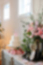 Wedding and event florals with cake and pink roses.
