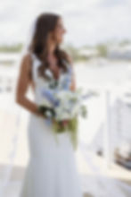 Bride holding blue and white wedding and event florals