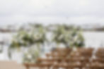 Wedding and event florals at a waterfront ceremony