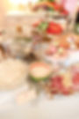 Wedding and event florals on a gourmet catering table.