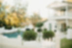 Outdoor backyard wedding and event florals by a pool.