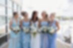 Bride and bridesmaids holding wedding and event florals