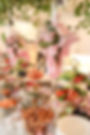Pink wedding and event florals on a buffet table.