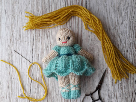 How I add yarn hair to my small knitted dolls