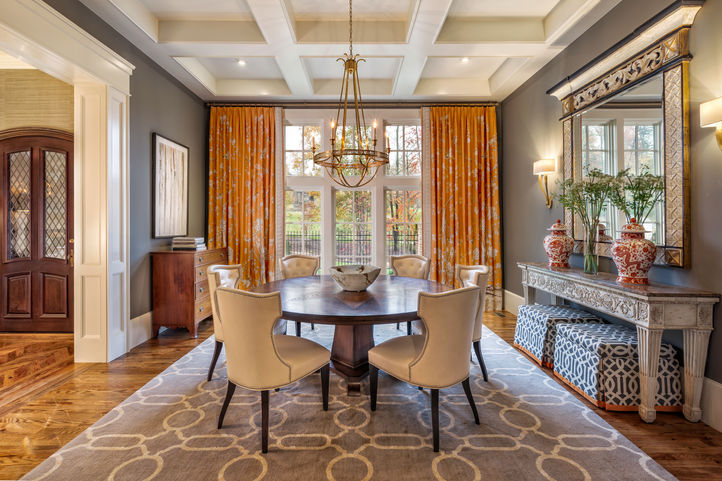 Formal dining room with wallpaper accents and arched windows | Refined entertaining spaces in Greenville and Highlands North Carolina