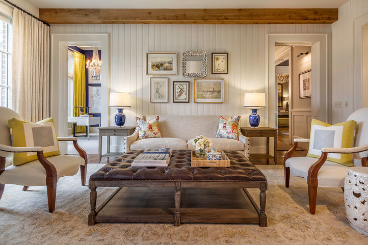 Cozy living room with layered furnishings and wall gallery | Traditional-meets-modern interiors in homes across Greenville and Lake Keowee