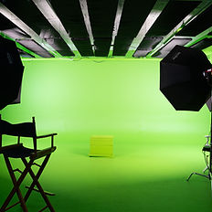 Green screen studio with lights and chair; Green Screen Rental for filming projects.