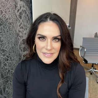Professional headshot of smiling woman