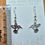 Thumbnail: Silver Hummingbird Outline Dangle Earrings 