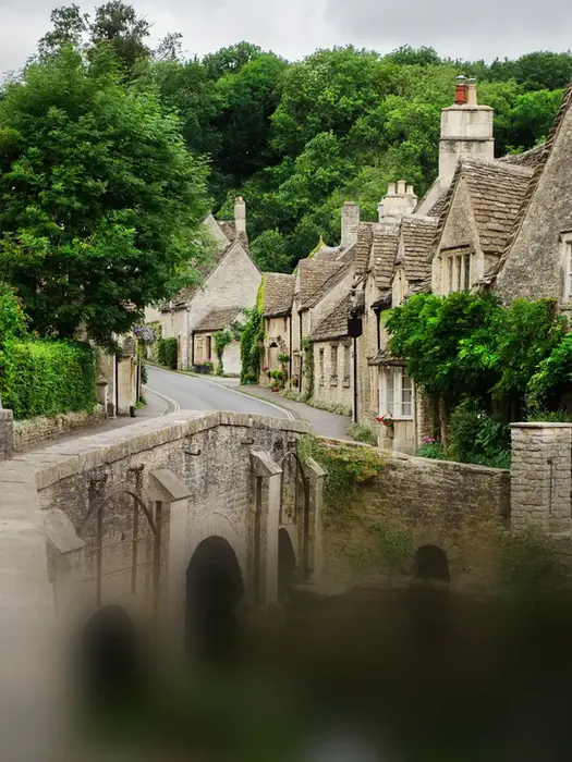 Traditional stone cottages in a Cotswolds village, visited during a relaxing private tour through the English countryside.
