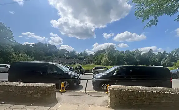 A premium travel experience through the historic High Street of Burford, Cotswolds, where Crownwood Charters provides a luxury chauffeur service and personalised tours for an impeccable and ultra-refined journey.