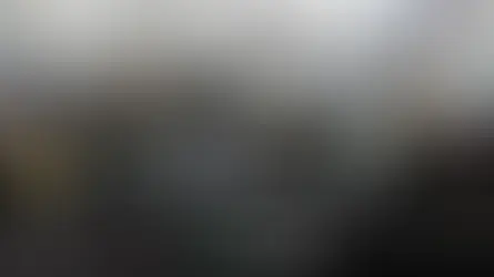 Travellers waiting in line at Heathrow immigration passport control after arriving at the airport.