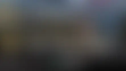 Heathrow Airport Terminal 3 exterior entrance with illuminated “Terminal 3” sign at dusk, used as banner image for a guide about how long it takes to leave Heathrow after landing.