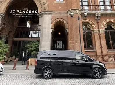 Chauffeur-driven executive car outside St Pancras for private luxury hotel transfers